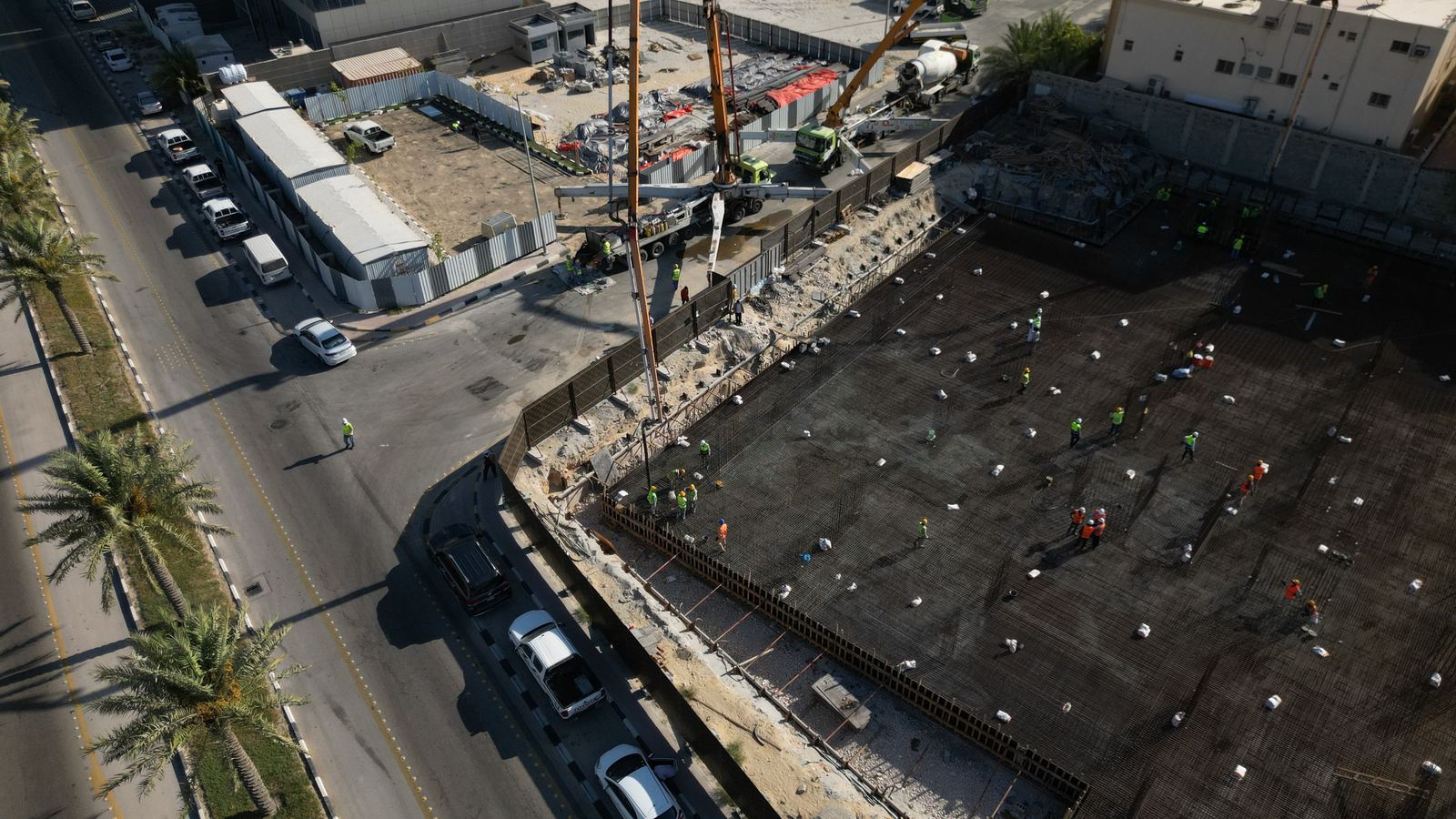 Drone view of an nzr project under construction — cranes and foundation works