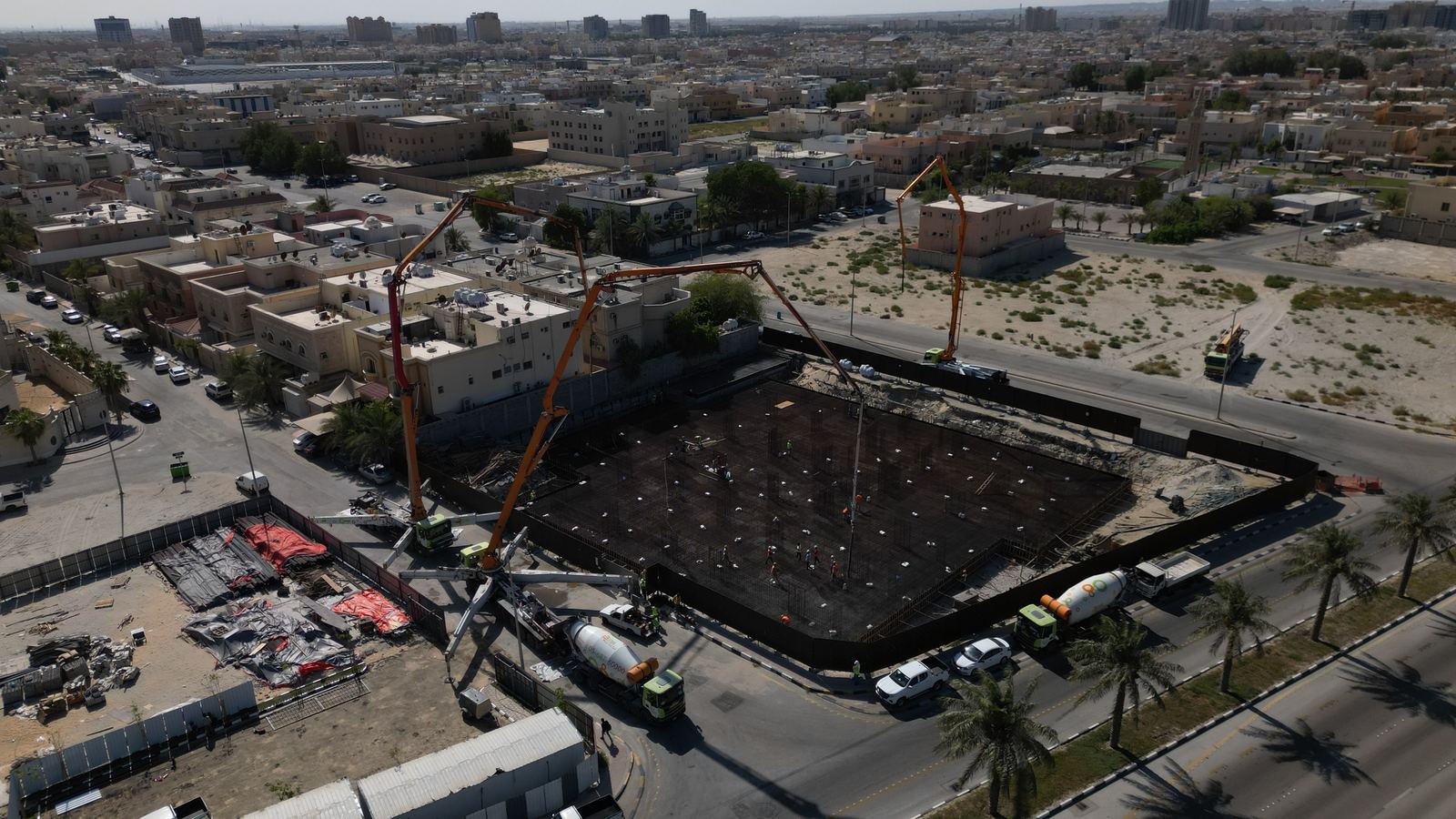 Drone view of an nzr project under construction — cranes and foundation works