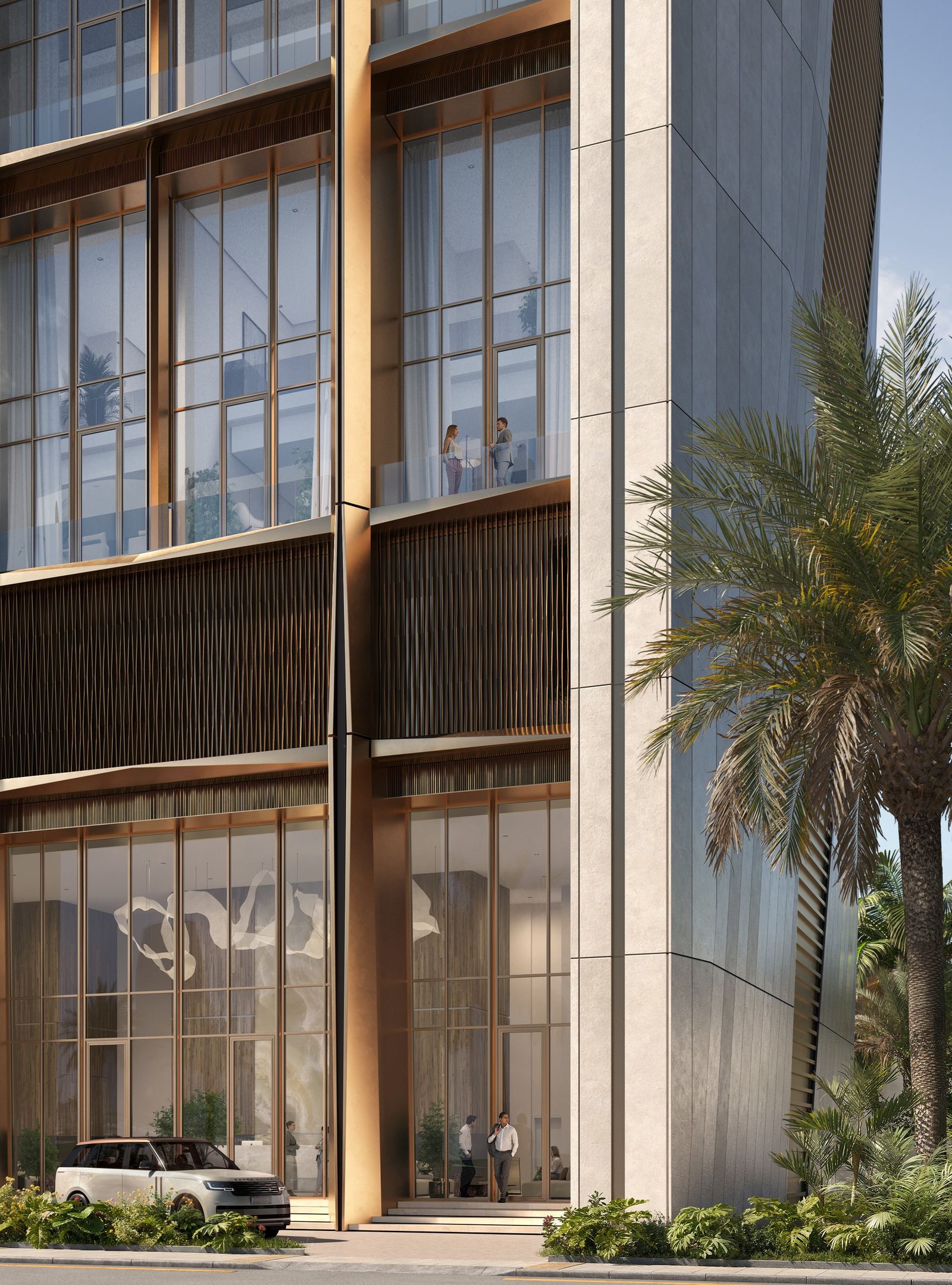 Street-level view of The View tower entrance, bronze-clad portals and palm trees at the podium